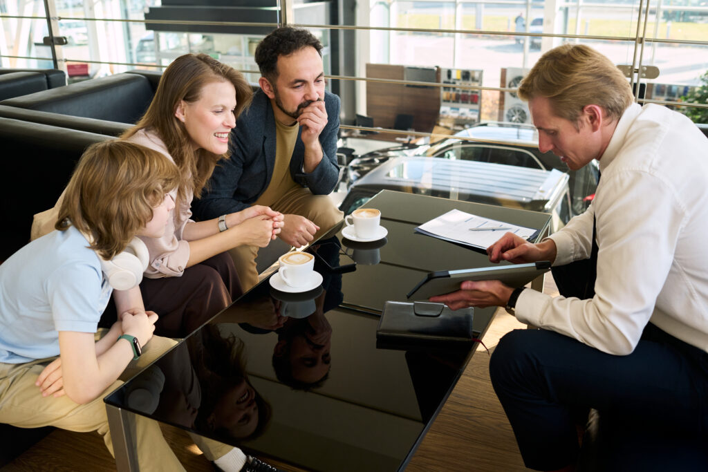 Family meeting with financial advisor discussing long-term wealth strategy and planning