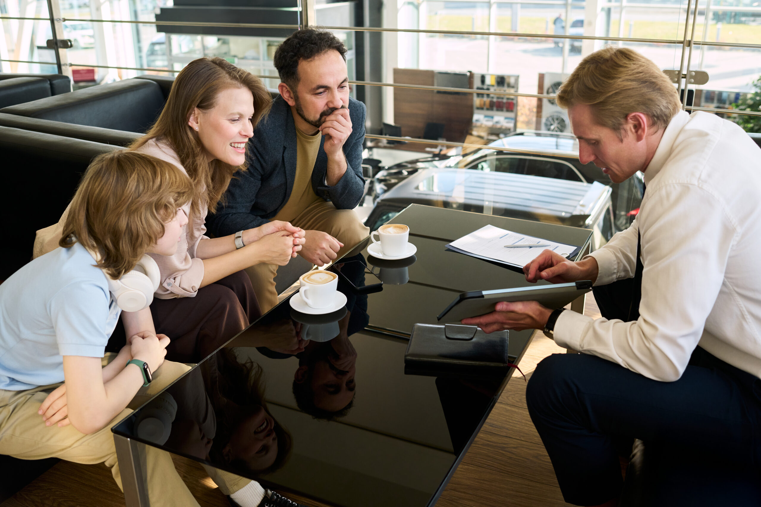 Family meeting with financial advisor discussing long-term wealth strategy and planning