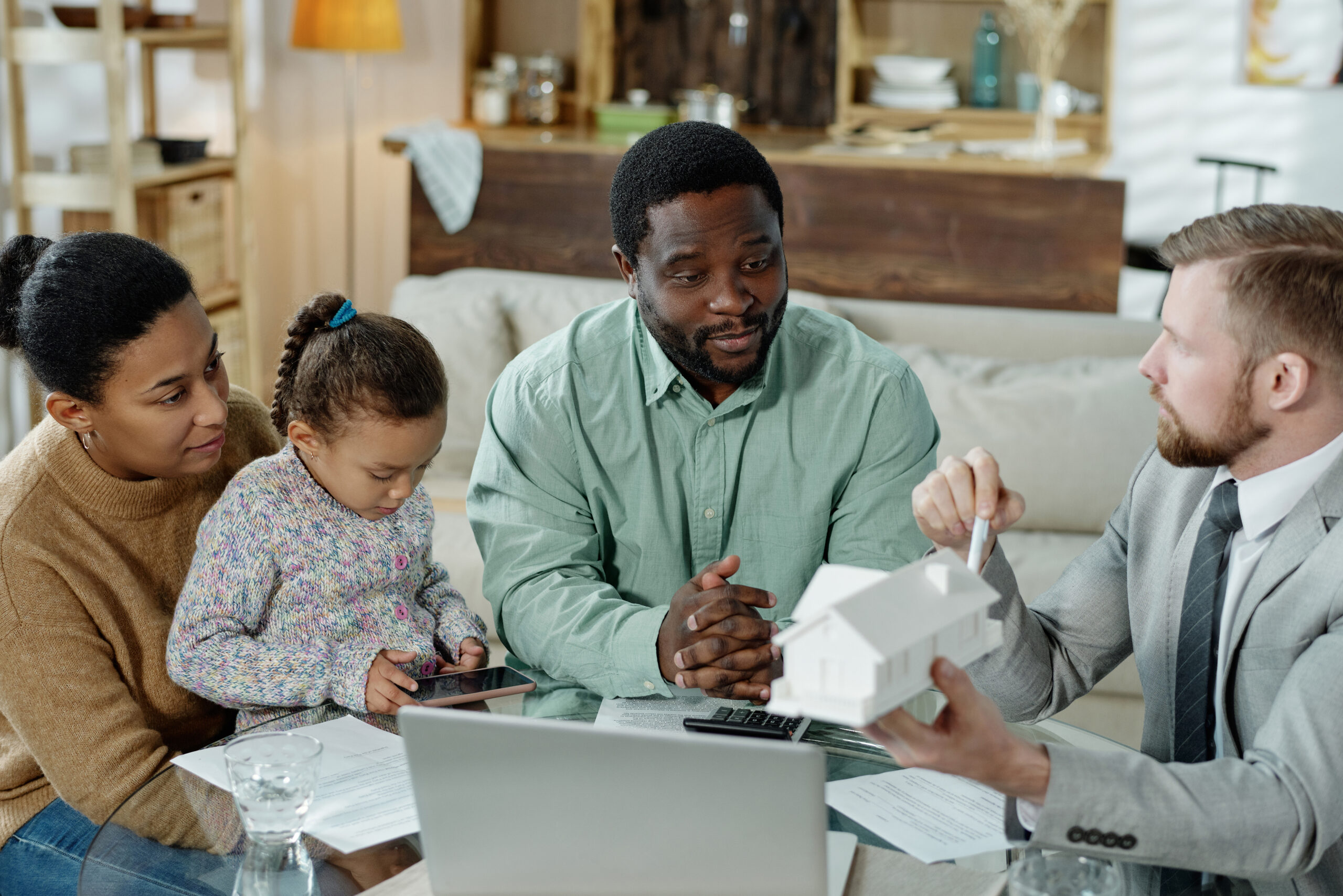 Family meets with a financial advisor to discuss wealth planning, legacy goals, and long-term investment strategies for future generations.