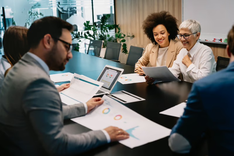 Business leaders discussing private equity vs family office investing during an investment strategy and governance meeting