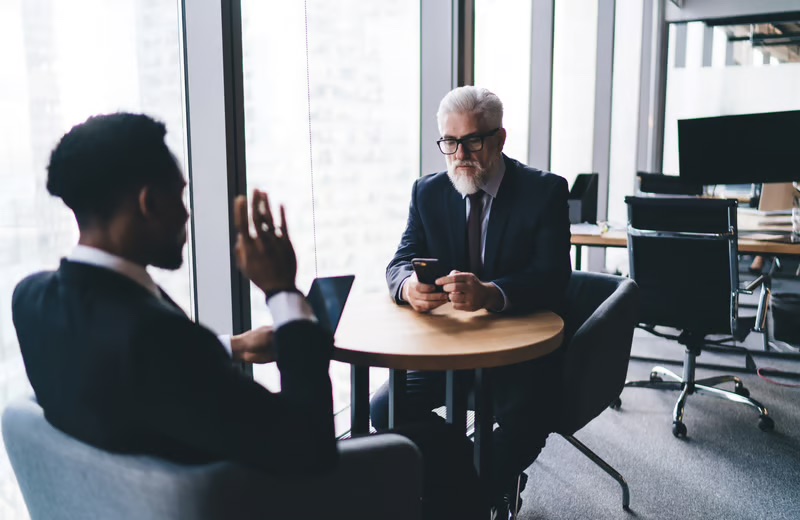 Experienced business mentor meeting with a founder to discuss leadership and strategic decision-making.